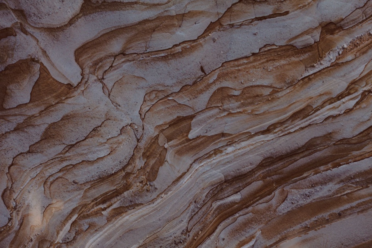 Sandstone structure with erosion patterns in Petra's archaeological site
