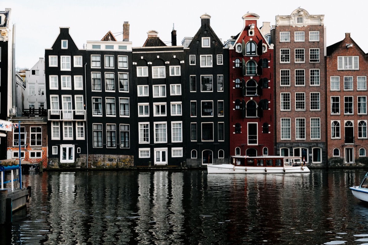 A close-up of a renovated canal house representing the urban real estate market.