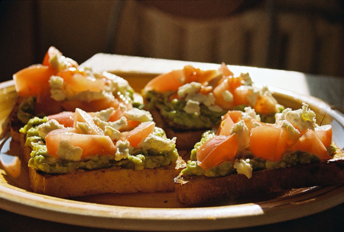 Artisan avocado toast on wooden board