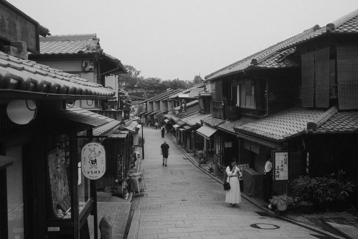 Explore the serene, traditional streets of Kyoto showcasing Japanese architecture and culture.