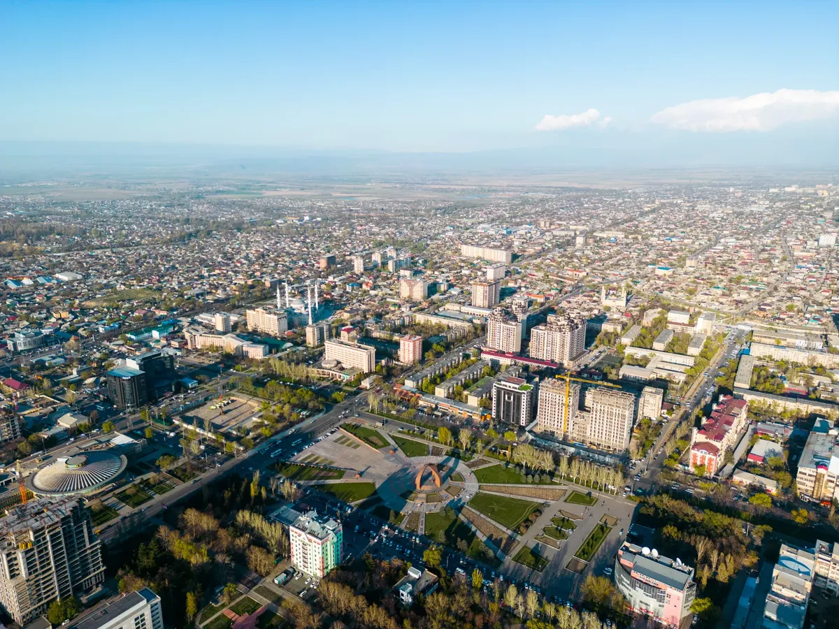 Stunning aerial view of Bishkek, Kyrgyzstan, showcasing its urban cityscape and local landmarks.